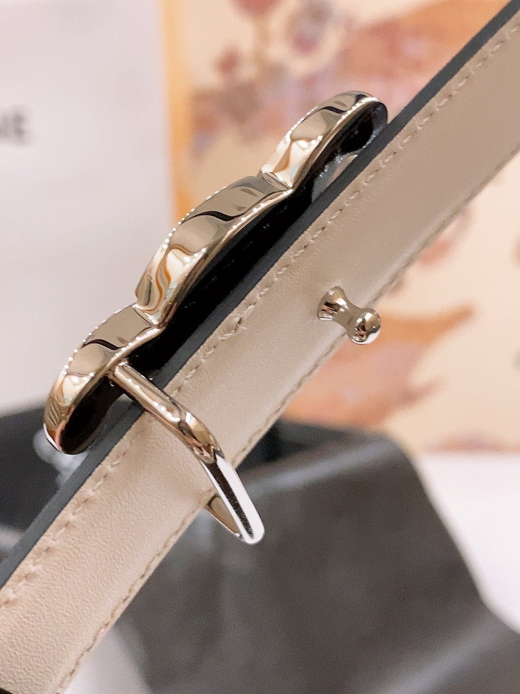 CELINE 25S BELT 25MM REVERSIBLE TRIOMPHE IN BLACK WHITE CALFSKIN 565542